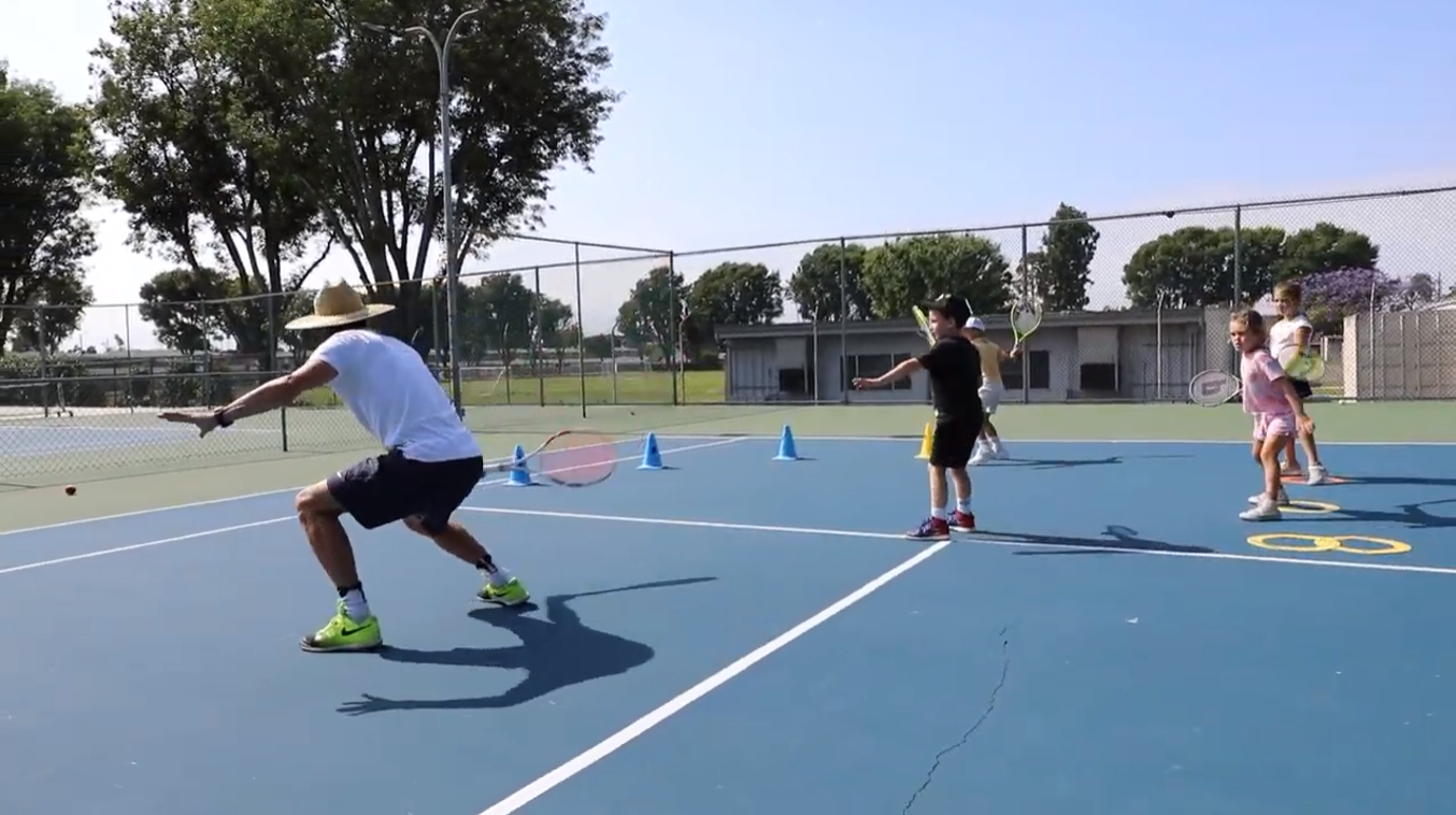 Nicolas Giachino practicing with kids