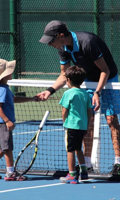 Nicolas Giachino giving instructions how to play tennis